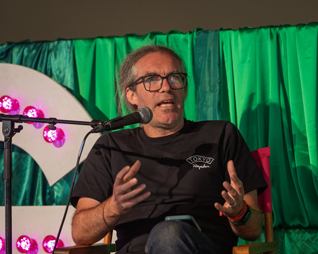 James speaking earnestly at Greenbelt 2025 - photo by Neil Mackin